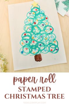 the paper roll christmas tree craft is made with colored crayons and glue to make it