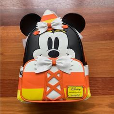 Nwt And Original Packaging! The Loungefly Disney Minnie Mouse Candy Corn Cosplay Mini Backpack Is An Officially Licensed Disney Product And Is Made Of Vegan Leather (Polyurethane). Bag Has Adjustable Shoulder Straps, Side Pockets, And Zippered Front Pocket. Cute Candy Corn, Candy And Mickey Ear Design On Interior Of Bag. The Candy Corn-Colored Striped Theme Carries Through Onto The Side Pockets And Strapsand In The Dark, All White Areas On The Bag Glow! Backpack Dimensions: 9”W X 10.5”H X 4.5”D Disney Minnie Mouse White Bag, White Mickey Mouse Backpack For Disney Trips, White Mickey Mouse School Backpack, White Mickey Mouse Backpack For Travel, White Mickey Mouse Bag For Disney Fan Events, White Mickey Mouse Travel Backpack, White Minnie Mouse School Bag, White Backpack For Halloween, White Halloween Backpack For Travel