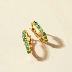 Ross-Simons - .40ct t. w. Emerald Huggie Hoop Earrings in 14kt Yellow Gold. 1/2". RS Pure. Modern designs that complete your outfit and complement your personality. Liven up your everyday looks with these petite huggie hoop earrings featuring .40 ct. t. w. round emeralds in 14kt yellow gold. Solo or stacked with simple studs, they will become a favorite in your minimalist rotation. Hanging length is 1/2". Snap-bar, emerald huggie hoop earrings. Emerald birthstones are the perfect gift for May bi Elegant Stackable 14k Gold Earrings, Elegant Yellow Gold Stackable Huggie Earrings, Elegant 14k Gold Stackable Earrings, Stackable Yellow Gold Earrings Fine Jewelry, Stackable Yellow Gold Fine Jewelry Earrings, Stackable Yellow Gold Earrings For Anniversary, Yellow Gold Stackable Earrings Fine Jewelry, Yellow Gold Stackable Fine Jewelry Earrings, Elegant Stackable Hoop Earrings