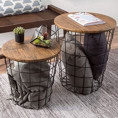 two tables sitting on top of a rug in front of a bench with a plant