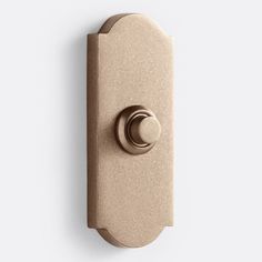 an image of a door handle on a white wall with a round knob in the middle