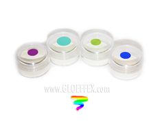 four small jars with different colored lids