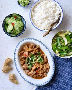 the meal is prepared and ready to be eaten with rice, cucumbers, and other vegetables