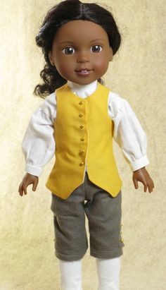 the doll is wearing a yellow vest and white shirt