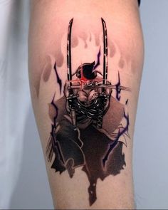 a man's leg with a tattoo on it that has an image of a person holding