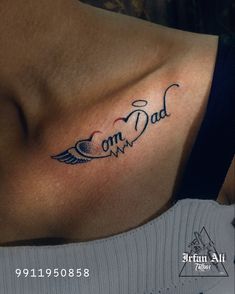 a woman with a tattoo on her chest that says, i am dad and an angel