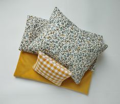 three pillows sitting on top of each other