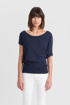 If you're in the mood to lounge luxuriously, Elena is the move. Fashioned from silky soft, eco-friendly European jersey, our all-day/all-night top features a loose scoop neck and asymmetric sleeves with a batwing on one side. Her oversized silhouette tapers below the waist for a flattering fit. Elena's versatile enough for professional or casual looks. | Ariane, in dark blue and in light beige, is 5’10.5” (179 cm), wearing size XS. Natalee, in black, is 5'10" (178 cm) tall, wearing size M. Sam i Scoop Neckline Blouse, Round Neckline Blouse, Batwing Shirt, Minimalist Blouse, Lounge Luxury, Night Tops, In The Mood, Ethical Fashion, Womens Clothing Tops