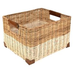 a large wicker basket with leather handles