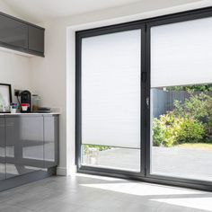 an open sliding glass door in a kitchen