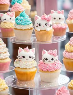 there are many cupcakes that have different designs on them, including cats and unicorns