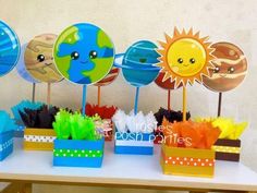 the table is set up with paper sun and planets