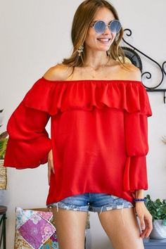 The Black Off The Shoulder Top can be styled with shorts, jeans, pants or just about anything! Description: TRIPLE LAYERED BELL-SLEEVE OFF SHOULDER TOP100% POLYESTER. MADE IN USA.Category: Bella Chic Tops & TeesFabric: 100% POLYESTER.Made In: USA Red Off-shoulder Tops For Fall, Fall Off-shoulder Red Tops, Fall Season Red Off-shoulder Tops, Flirty Solid Top For Night Out, Casual Red Off-shoulder Top, Flirty Ruffled Tops For Fall, Flirty Red Top With Ruffles, Long Sleeve Flirty Top For Summer, Solid Tops For Spring Date Night