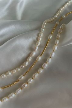 rice pearls | pearls | beads | seed beads | gold beads | gold bracelets | white seed beads | handmade | jewelry | trendy | aesthetic | affordable | beachy | tropical | fashion | accessories | summer | tiktok | small business | isabelles jewelry | clean girl | silk | satin | white | freshwater | summer | 2023 | pearl | gemstones | gem | instagram | etsy | small business | miami | coastal | Clean Girl Necklace, Pearl Chain Choker With Round Beads, Pearl Choker With Round Beads, Pearl White Beaded Choker, Crocette Aesthetic, Bead Bracelets Aesthetic, Freshwater Pearl Jewelry Handmade, Cleangirl Outfit, Clean Girl Jewelry