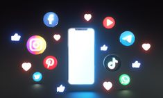 an illuminated cell phone surrounded by social media icons