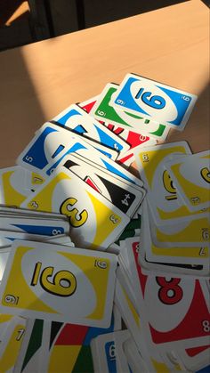 a pile of unopened cards sitting on top of a table