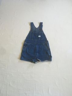 "vintage 1970s shorts jean bib overalls Big Mac 100% cotton Union made blue denim  adjustable shoulder strap donut button fly hemmed shorts good vintage condition, light wear measures, lying flat, bib top width-10\" bib bottom width-16\" bib height-11\" waist-17\" hip-21\" inseam-1 1/2\" rise-13 1/2\" hem-13 1/2\"" Retro Dark Wash Shortalls With Pockets, Vintage Blue Shortalls, Vintage Bib Front Shortalls With Pockets, Vintage Blue Cotton Shortalls, Blue Vintage Cotton Shortalls, Retro Denim Bib Front Shortalls, Vintage Denim Bib Front Shortalls, Vintage Denim Shortalls With Bib Front, Vintage Denim Blue Cotton Shortalls