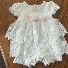 This Is Nwot. It’s A Lace Dress But Has The Snap Pants Underneath It. Very Cute. Smoke Free. Pet Free Home. Cotton Bubble Romper With Short Sleeves For Baptism, White Short Sleeve Bubble Romper For Spring, White Bubble Romper With Ruffles And Short Sleeves, White Short Sleeve Bubble Romper For Baptism, White Fitted Bubble Romper For Baptism, Fitted White Dress For First Birthday, White Fitted Dress For First Birthday, Fitted Spring Baptism Dress For First Birthday, White Short Sleeve Baptism Dress