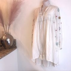 Cream Colored Silk Dress Is Sheer With Embroidery On Sleeves Two Front Tassels Excellent Used Condition No Pockets Or Zipper Made In India Sleeves Have One Button Size: Large Measurements Are Approximate Bust: 24 Inches (Front) Shoulder To Hem: 32.5 Inches (Back) Shoulder To Hem: 40 Inches Sleeve Length: 24 Inches {#46 S/S Dresses} Questions? Leave A Comment Below! Offers Welcome! Embroidery On Sleeves, Back Shoulder, Anthropologie Dress, Silk Dress, Cream Color, Tassels, Anthropologie, Let Me, Midi Dress