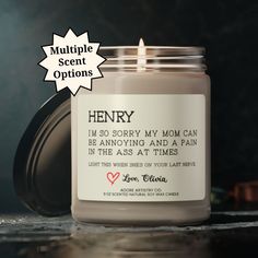 a candle with the words henry written on it in front of a black and white background