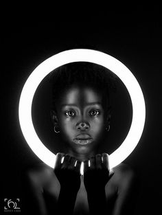 a woman with an illuminated circle around her head