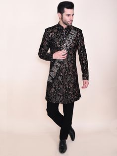 Item contains : Jacket and Pants  Fabrics :    Luxury velvet Colours :  black Style and Designs :  sherwani Indo has mandarin collar and long sleeves with a full button placket asymmetric hem and multiple  slits symmetrical button placket  it has all over resham thread embroidery with shader of golden and brown  Pants or Trousers- Pants boot cut style pants with 2 pockets and a fly on zip and hooks  Size :  Slim fit  Model height is 6 fit and wearing 40 size  Material and Care :  Polyester mix  Only dry clean  Note : There might be minor differences in colours and appearance as a result of photography and lighting  Cut a dash with your personality in your next gathering take this Party House outfit!!  Customise Tailoring Available  We can make your special day dress more special by adding Embroidered Party Wear Kurta With Traditional Drape, Party Wear Long Sleeve Kurta For Diwali, Party Wear Unstitched Suit With Long Sleeves For Reception, Party Wear Long Sleeve Kurta With Resham Embroidery, Party Wear Traditional Long Sleeve With Pallu, Long Sleeve Kurta With Resham Embroidery For Party, Party Wear Bandhgala With Traditional Drape For Festive Occasions, Embroidered Long Sleeve Traditional Party Wear, Long Sleeve Bandhgala For Diwali Party