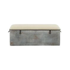 an old metal box with a cushion on the top and bottom, sitting against a white background