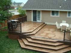 a wooden deck with steps leading up to it