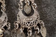 I am offering you these vintage sterling silver gorgeous detailed large and wide ornate filigree scrolled etched euro wire pierced dangle drop earrings. There is endless amounts of open work , heavily etched , raised relief filigree. It is larger than most, measuring app. 2.25 inch, by app. 1 inch , and very layered and dimensional. They weigh app. 4.5 grams. It is a must have for the vintage jewelry collector. Buyer pays all shipping and handling fees, we will always combine shipping. Ornate Engraved Dangle Jewelry, Vintage Etched Dangle Jewelry, Ornate Antique Silver Etched Jewelry, Ornate Etched Antique Silver Jewelry, Ornate Sterling Silver Pierced Chandelier Earrings, Ornate Sterling Silver Chandelier Earrings, Vintage Silver Filigree Earrings, Ornate Silver Filigree Earrings, Ornate Nickel-free Sterling Silver Earrings