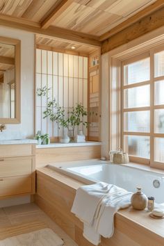 a bathroom with a large bathtub next to a window