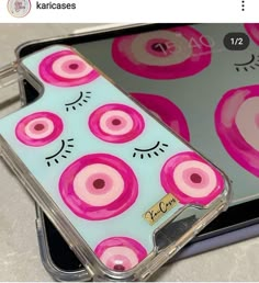 the case is designed to look like it has pink circles and cat ears on it