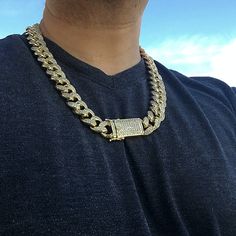 Men's 24"x 19 mm wide Cuban hip hop chain necklace. 14K gold plated finish over high quality brass metal core. Thick & heavy chain has serious weight to it at 315 grams. Chain links encrusted with round cut vivid CZ stones. Gold Cuban Link Jewelry For Streetwear, Gold Chain Link Jewelry For Streetwear, Gold Cuban Link Necklace With Curb Chain For Streetwear, Gold Cuban Link Necklace For Streetwear, Gold Iced Out Chain Link Necklace, Gold Link Jewelry For Streetwear, Gold Chain Link Necklace For Streetwear, Gold Chain Necklace For Streetwear, Gold Figaro Chain Necklace For Streetwear