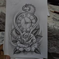 a drawing of a clock with roses on it