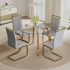 a glass table with four chairs and a vase on top of it in a living room