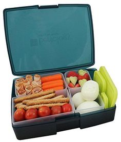 an open lunch box filled with fruits and vegetables