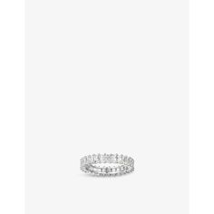 a white gold ring with three rows of diamonds on the inside and outside of it