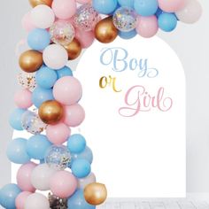 a boy or girl arch with balloons and confetti on the top, in front of a white backdrop