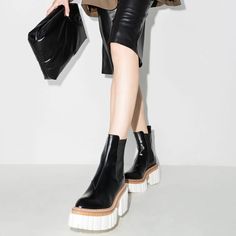 New Without Box It's Time To Give Those Old Shoes In Your Closet The Boot. Make Room For These Stella Mccartney Chunky Chelsea Boots Instead That Have A Striking Contrasting Ridged Rubber Sole That's Ready To Storm The Streets With Confidence. Step Out With Bold Pride In These Shoes. Made In Italy Highlights Black Faux-Leather Pointed Toe Stitched Panels Elasticated Side Panels Pull-Tab At The Heel Ridged Rubber Sole Positively Conscious: This Animal Conscious Product Is Constructed From Vegan L Chic Calf Leather Platform Boots With Lug Sole, Stella Mccartney Boots Outfit, High-top Chelsea Boots With Contrast Sole, Stella Mccartney Boots, Luxury Slip-on Chelsea Boots With Stitched Sole, Chunky Chelsea Boots, Old Shoes, Black Faux Leather, Panel Siding