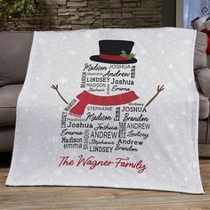 a personalized christmas blanket with a snowman on it and the names of different family members