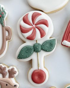 decorated christmas cookies on a white surface