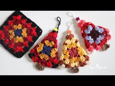 three crocheted ornaments are sitting on a table