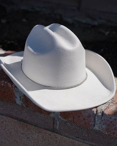 Sparkle & shine in our Ivory Rhinestone Cord Strap Cowboy Hat! This dazzling white cowboy hat adds subtle glam to your already wonderful outfit. Pair with your favorite corset top, skirt and boots for a fun night out! Cheap Casual White Hat Bands, Luxury White Elegant Hat Bands, Luxury White Brimmed Hat Bands, Subtle Glam, White Cowboy Hat, Skirt And Boots, Cowgirl Hats, Cowboy Hat, Corset Top