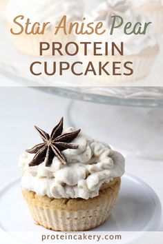 a cupcake with white frosting and star anise on top, sitting on a plate