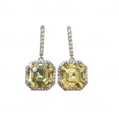 Introducing our exquisite Asscher Cut Canary Yellow Simulated Diamond ( Premium High Grade 5A Cubic Zirconia ) Dangle Drop Hook Wire Earrings, crafted in a lustrous 14k White Gold Finish on 925 Sterling Silver. Elevate your jewelry collection with these stunning Art Jewelry creations that exude timeless elegance and unparalleled sophistication. Key Features: - Stone Type: Simulated Asscher Cut Canary Yellow Diamond ( Premium High Grade 5A Cubic Zirconia ) - Metal: 925 Sterling Silver - Closure: Canary Yellow Diamonds, Asscher Cut, Canary Yellow, French Wire, Silver Art, Cz Diamond, Wire Earrings, Yellow Diamond, Jewelry Creation