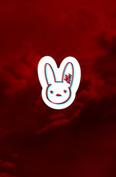 a red sky with clouds and a white bunny face