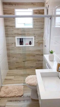 a bathroom with a toilet, sink and shower stall is shown in this image from the inside