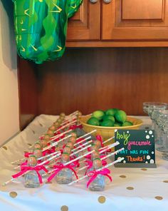 a table topped with lots of candy and limes