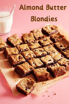 chocolate chip blond butter blondies on a cutting board next to a glass of milk