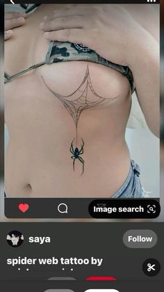 a woman with a spider tattoo on her stomach