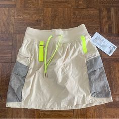 Lululemon Light Tan Multi Pocket Cargo Skirt With Yellow And Gray Detailing. Super Cute For Hiking Or Just Casual Wear. Has Built In Shorts Underneath! Brand New With Tags. Size 4 Lululemon Tennis Skirt, Hiking Skirt, Street Skirt, Lululemon Shirt, Athletic Skort, Black And White Skirt, Cream Yellow, Golf Skirts, Cargo Skirt